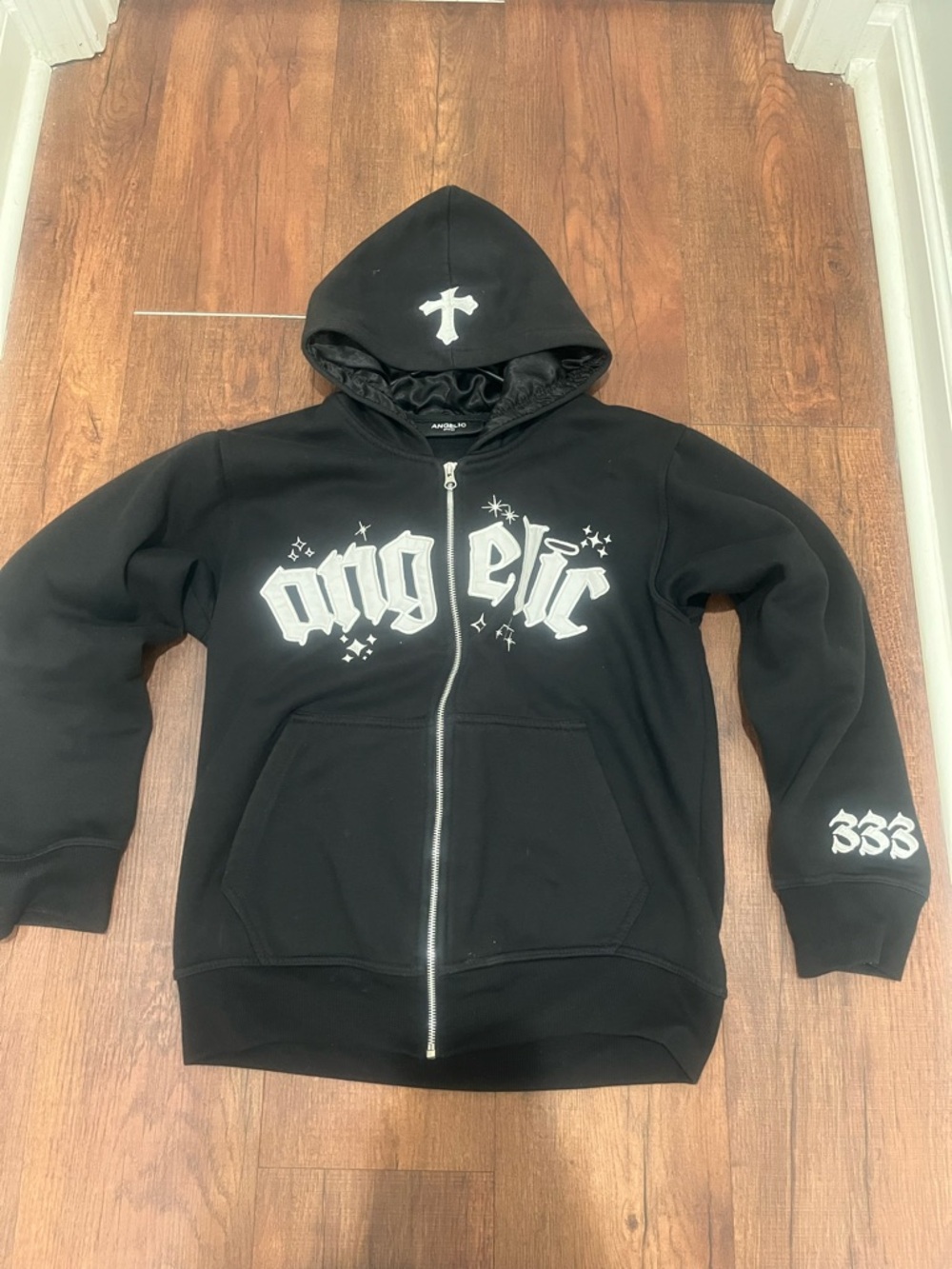 Angelica Black Hoodie with White Cross Graphic